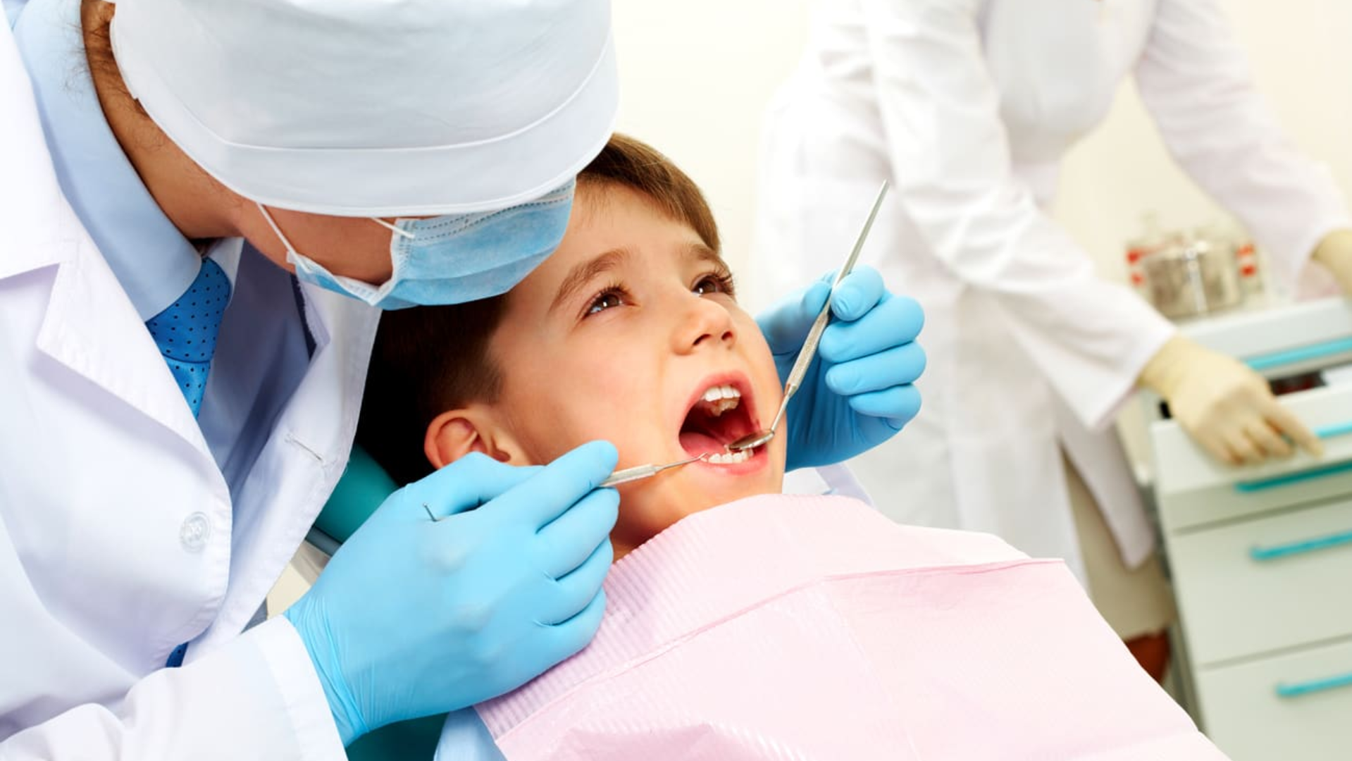 Pulpectomy procedure in a child’s baby tooth showing removal of infected pulp from crown and root canals followed by filling with resorbable material.