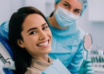 Dentist checking child and parent after vacation dental visit